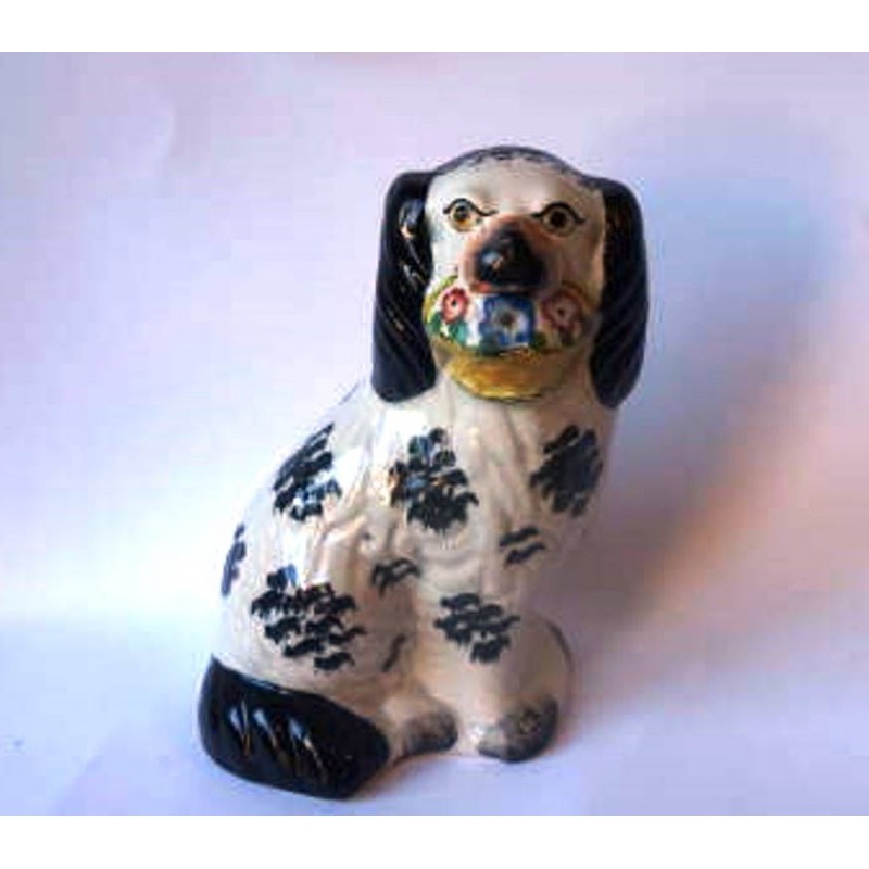 Staffordshire Pottery single Spaniel holding flower basket