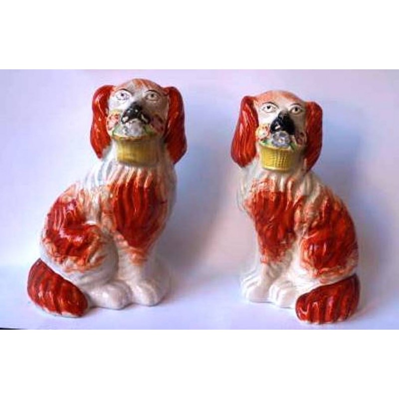 Staffordshire Pottery pair Spaniels with flower baskets