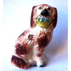 Staffordshire Pottery single Spaniel holding flower basket