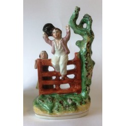 Staffordshire Pottery Children playing on gate