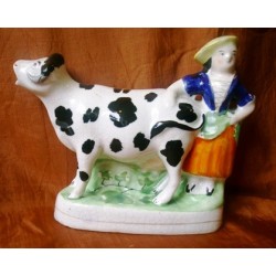 Black patch cow and milkmaid
