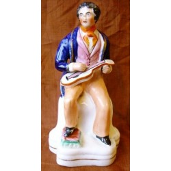 Staffordshire Pottery seated musician