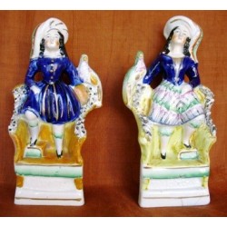 Staffordshire Pottery children with exotic bird, pair