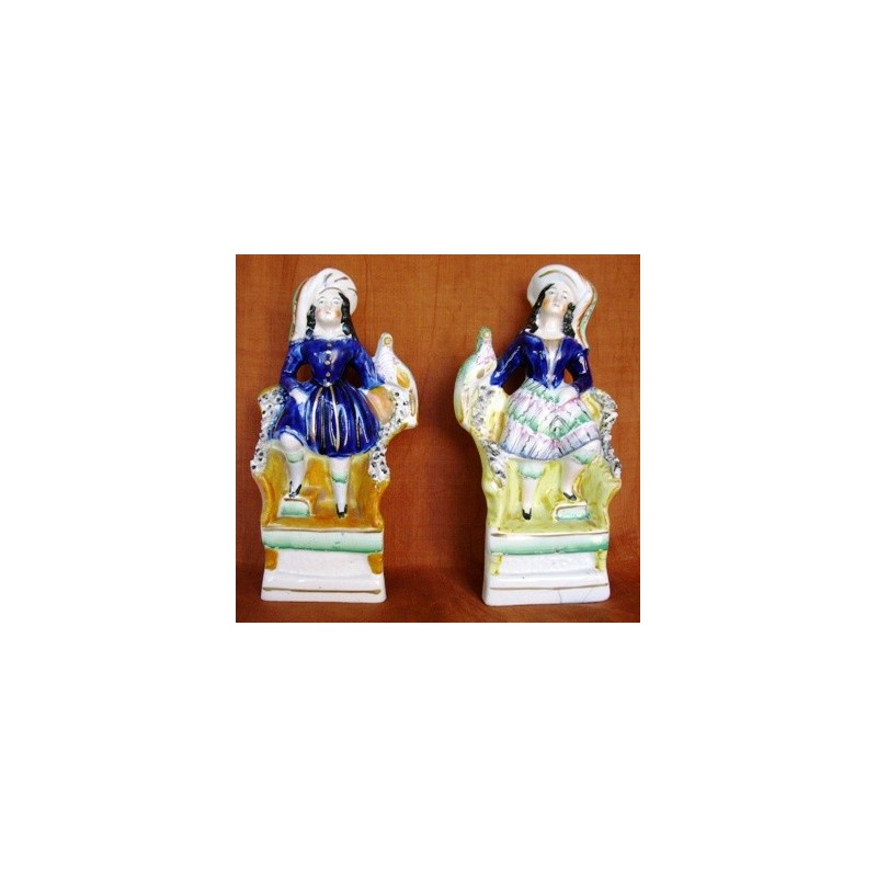 Staffordshire Pottery children with exotic bird, pair