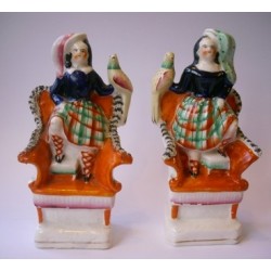 Staffordshire Pottery children with exotic birds.Pair