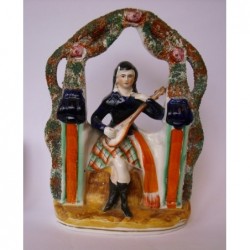 Staffordshire Pottery seated musician