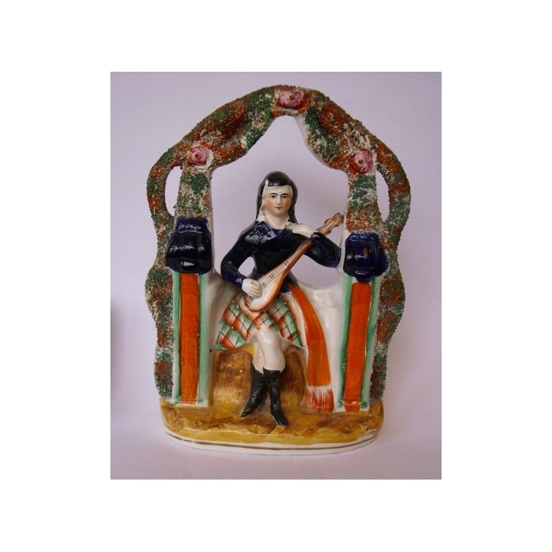 Staffordshire Pottery seated musician