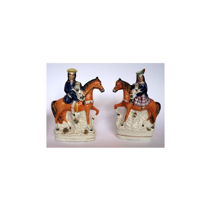 Equestrian boy and girl with Spaniels. Pair