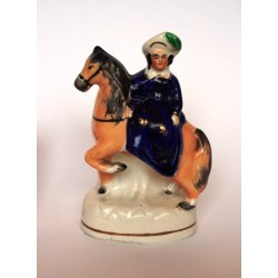 Staffordshire figure of Child on a pony