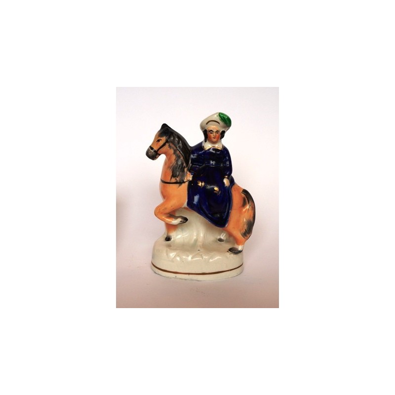 Staffordshire figure of Child on a pony